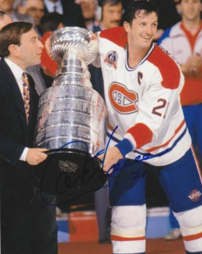 Guy Carbonneau accepting the Stanley Cup from NHL commissioner Gary Bettman
