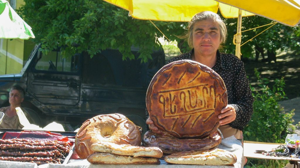 Locals selling goods near the churches in Armenia