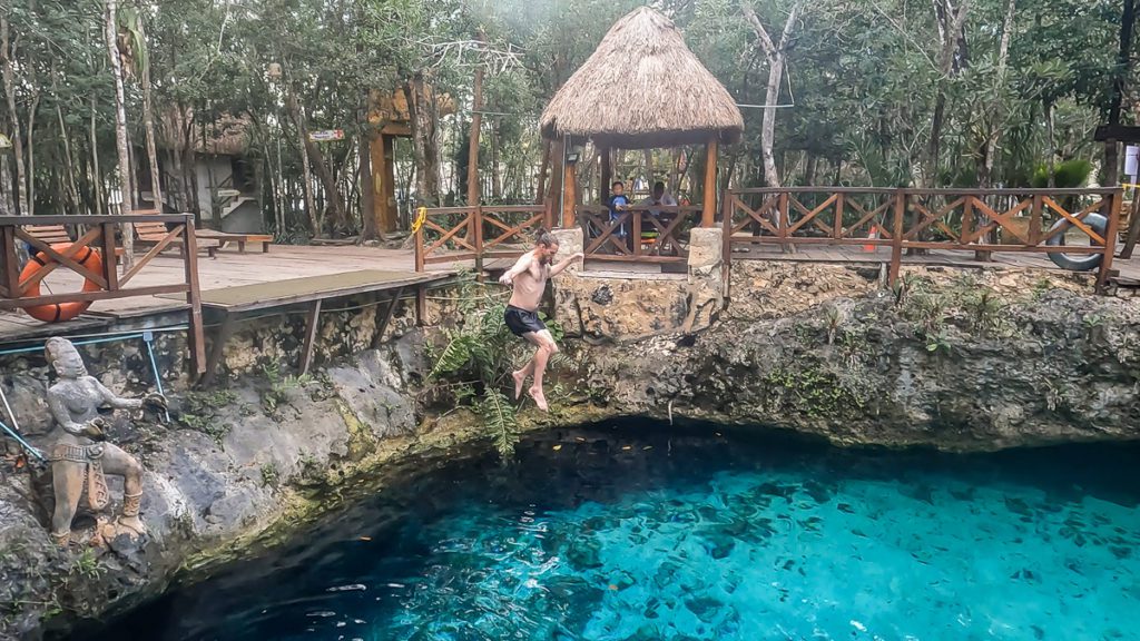 Jumping at Zacil ha cenote in Quintana Roo