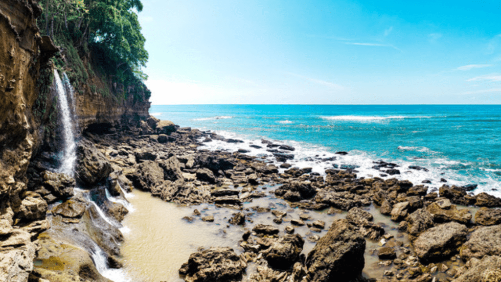 Montezuma beach in Costa Rica. A unique central american beach with a waterfall